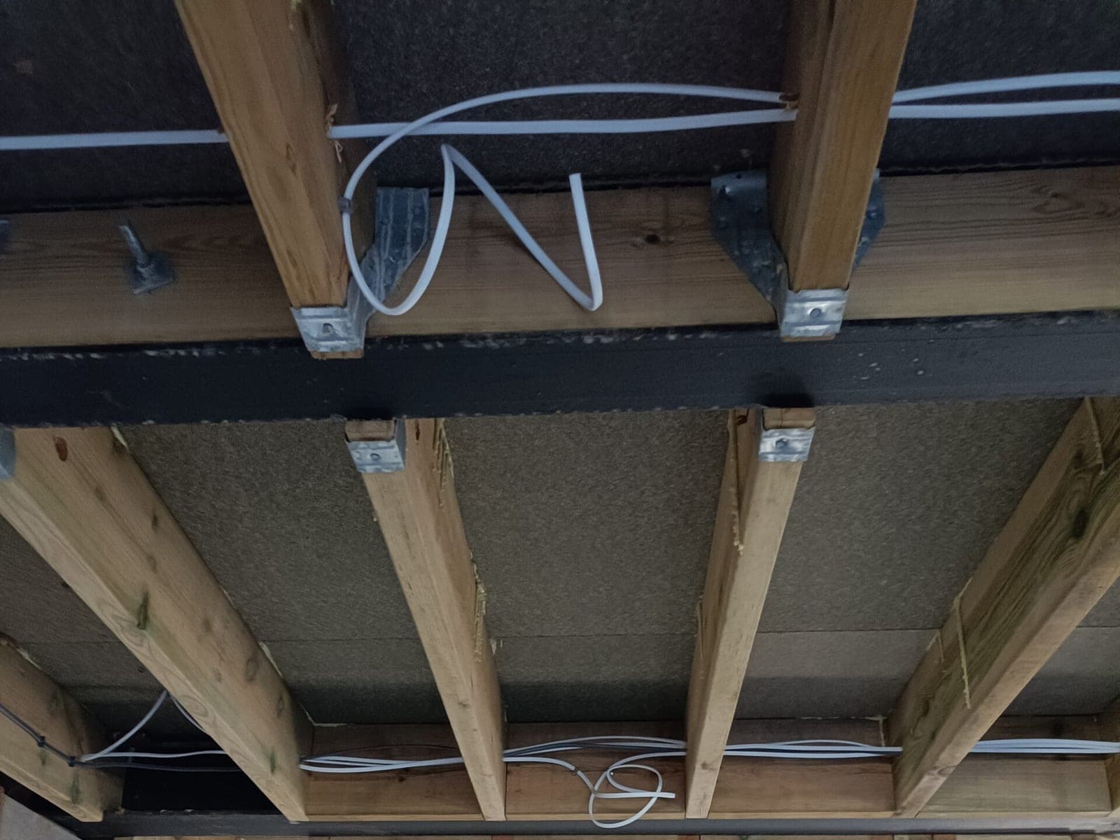 First fix cables clipped through new ceiling joists during a renovation